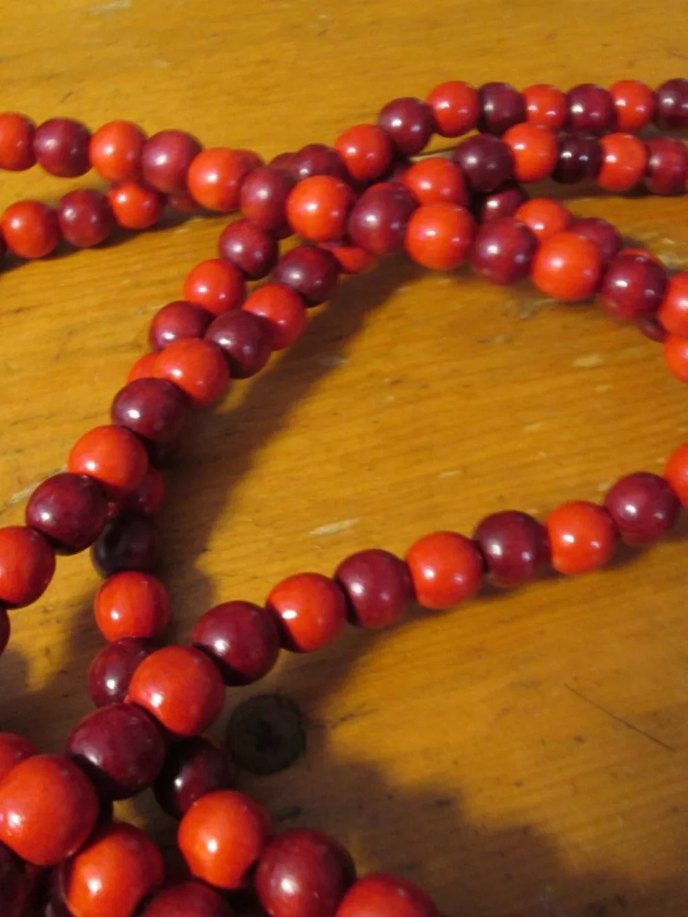 3 strands of cranberry wooded beads vtg 80s 105 in each strand for the tree